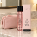 Mary Kay Oil-Free Eye Makeup Remover bottle and retail box beside a blush travel pouch