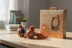 Planet Buddies Charlie the Tiger furry wired headphones on wooden study desk in soft natural daylight