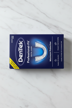DenTek Professional-Fit Dental Guard navy blue retail box displayed on marble with corrected lighting
