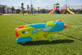 Wave Zone Steady Stream 2X water blaster on sunlit outdoor play area with artificial turf