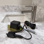 American Standard PK00.HAC hard-wired AC power kit shown beside a commercial sensor faucet service setting