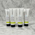 Four Mary Kay Clear Proof Clarifying Cleansing Gel tubes standing upright on grey marble - studio shot