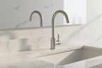 Lordear modern high arc brushed nickel bathroom faucet installed on white marble vanity in minimalist bathroom with soft morning light