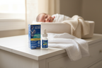 Mommy's Bliss Baby Probiotic Drops Vitamin D box on white nursery dresser beside sleeping newborn in soft-lit nursery - More4less Outlet