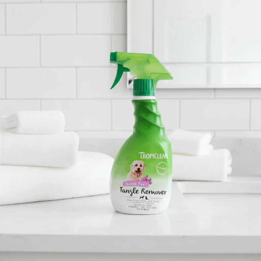 TropiClean Sweet Pea Tangle Remover 16 oz on bathroom vanity with white towels