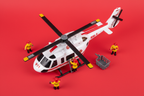 Maxx Action RH-1 911 helicopter toy flat lay on red background with rescue basket and firefighter figures