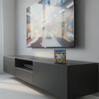 GTA V PS4 game case on black media console under flat-screen TV