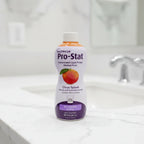 Nutricia Pro-Stat medical dietary nutrition bottle on high-quality sterile white bathroom counter, soft diffused studio lighting