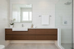 Clean contemporary bathroom featuring a polished chrome towel bar mounted above vanity