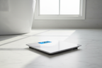 Taylor Digital Bath Scale on white marble bathroom floor with blue backlit display showing weight