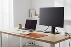 Belkin USB-C to VGA adapter on home office desk connecting laptop to external monitor while charging via pass-through — More4less Outlet
