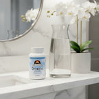 Source Naturals Optimistic Saffron Complex bottle on bathroom quartz vanity with white orchid and glass carafe of water