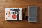 Wild Willies Wingman beard grooming set arranged on wooden surface beside gray folded towel
