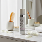 Color Wow Bombshell Volumizer white bottle on white marble vanity with soft morning light and luxury hair accessories – More4less Outlet