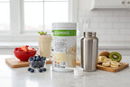 Organized breakfast smoothie station with fresh fruit, measuring scoop, and Herbalife Formula 1 French Vanilla canister