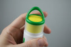 In-hand close-up of Will Relieve ergonomic roll-on applicator head with shallow depth of field