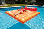 Cheez-It Giant Pool Float floating in sunny backyard swimming pool person lounging