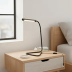 Globe Electric Arden LED Desk Lamp unboxed on light-wood nightstand in minimalist bedroom with soft natural window lighting