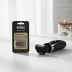 Braun Series 9 Pro shaver head replacement black retail pack beside modern electric shaver on white marble – More4less Outlet