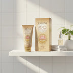 Morning skincare routine lifestyle scene with Jergens Natural Glow gold face moisturizer tube and box on bright white bathroom shelf