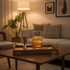 Silver One cocktail set on mid-century modern valet tray in upscale living room lounge with warm ambient lighting