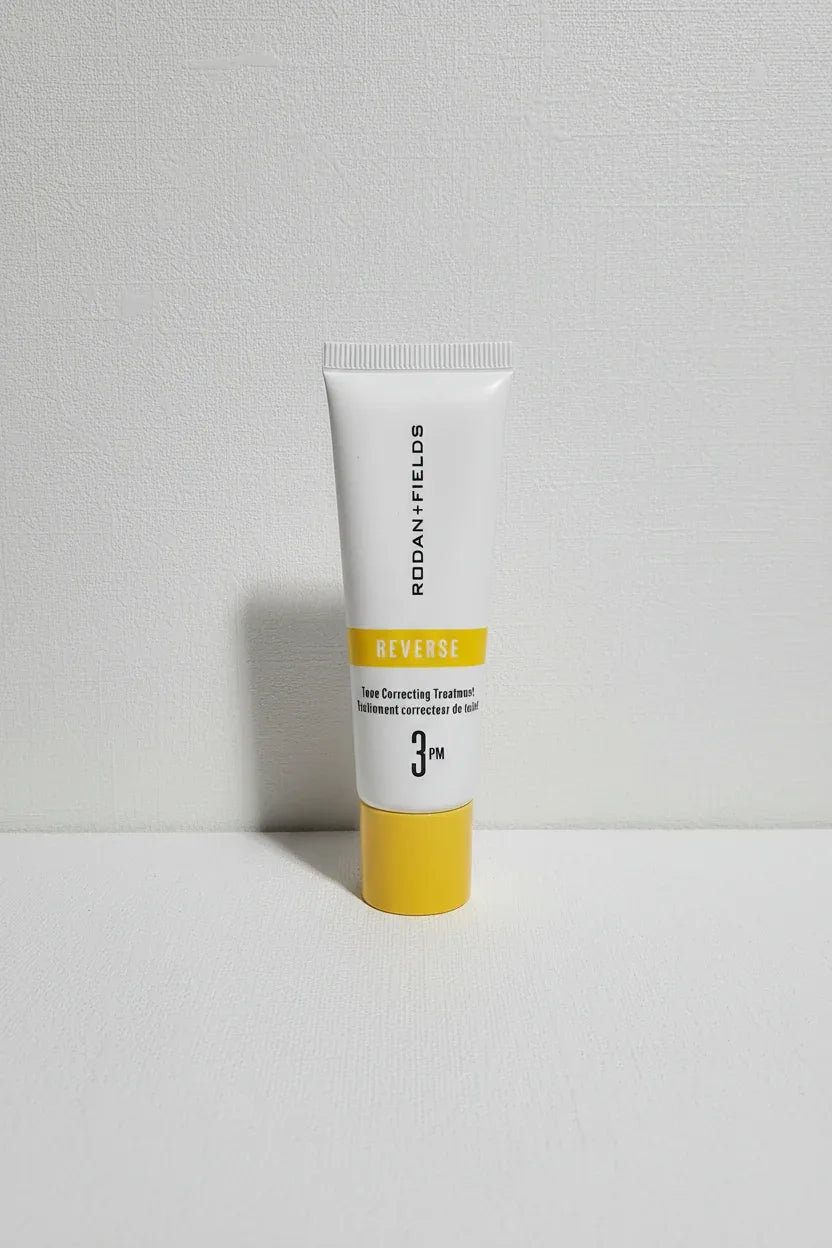 Rodan + Fields REVERSE tube against off-white textured backdrop studio product photography