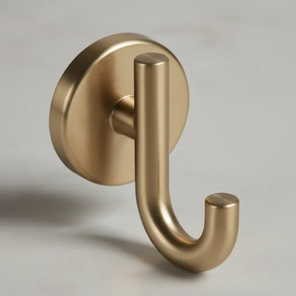 Macro detail shot capturing metallic geometry and champagne bronze finish texture of Delta Trinsic wall hardware
