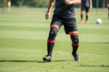 G-Form Pro-S Compact Shin Guards XL worn by soccer player on grass field during match
