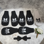 Lady and Home bridal party bottle sleeves flat lay on white marble with wedding rings bow tie and boutonniere