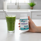 Person holding NutriCology L-Methionine bottle next to green smoothie in kitchen – More4less Outlet