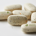 Macro close-up of Non-GMO certified dietary supplement tablets with whole food ingredients on white background – More4less Outlet