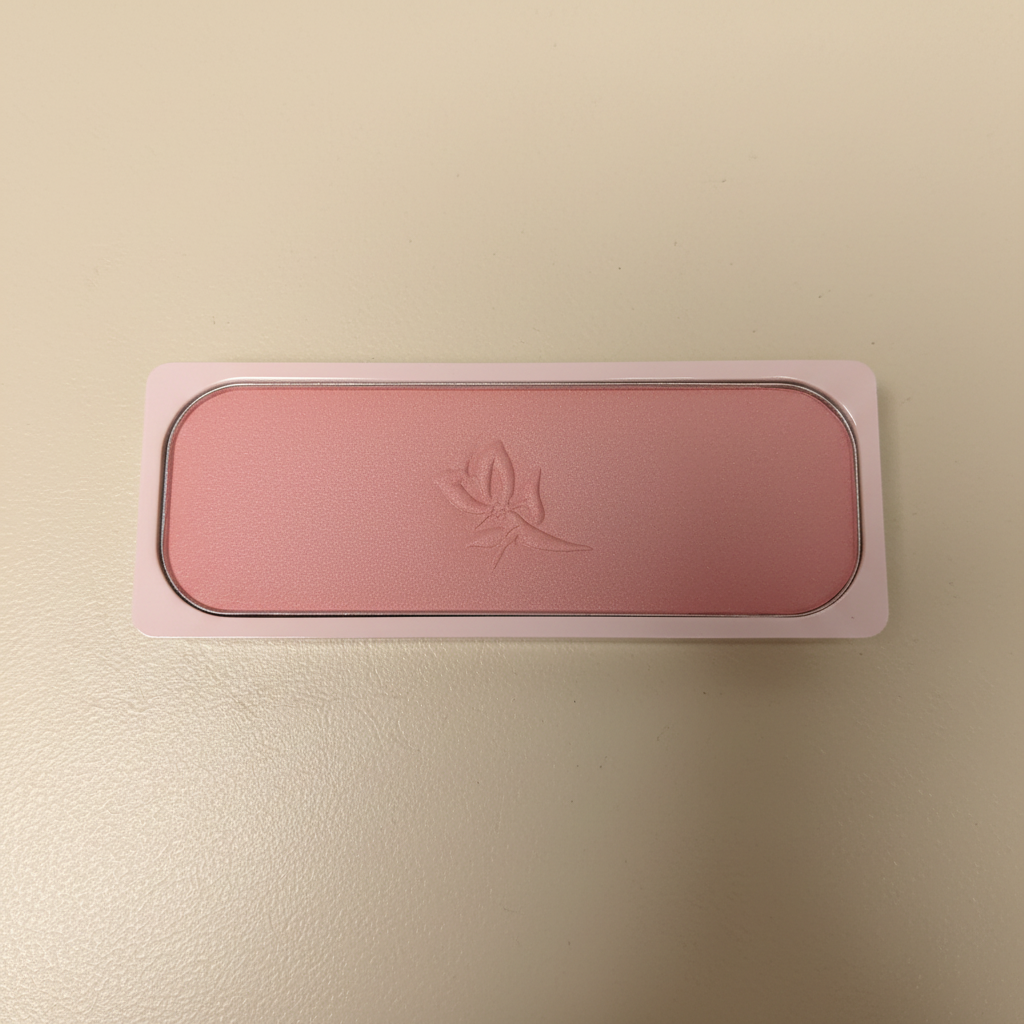 AI-generated flat-lay view of a Mary Kay Powder Perfect Cheek Color pressed blush refill pan in Wild Rose shade
