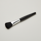 Mary Kay Classic Flat Paddle liquid foundation brush on a neutral surface