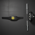 Gold's Gym black leather weight lifting belt laid flat on dark gym floor next to barbell and weight plates – More4less Outlet
