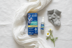 Mommy's Bliss Baby Probiotic Drops Vitamin D flatlay on white linen with dropper baby socks muslin swaddle and chamomile - More4less Outlet