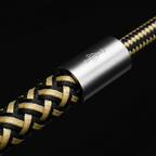 Close-up of tightly woven braided nylon and Kevlar fiber USB charging cable showing dual-shade weave texture and silver connector — More4less Outlet