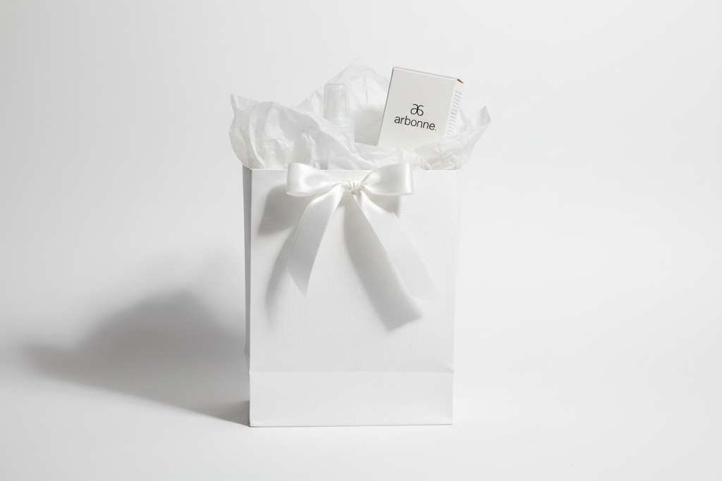 Arbonne TrueSmooth Apple Vinegar Hair Rinse bottle and box as premium clean beauty gift in white gift bag with ribbon – More4less Outlet