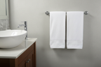 Delta Ara polished chrome towel bar in modern bathroom with vessel sink and chrome faucet — contemporary bathroom hardware