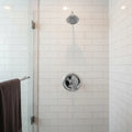 Moen Dartmoor chrome shower trim installed in luxury shower with white subway tile lifestyle image