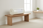 Eden Home cream garment washed sheet set neatly folded on modern light wood bench
