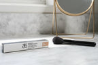 Arbonne The Real Conceal Liquid Concealer Tan on marble makeup vanity with natural daylight lifestyle