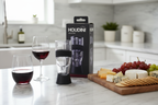 Houdini Wine Aerator on no-drip stand marble counter with wine glasses and charcuterie board - More4less Outlet