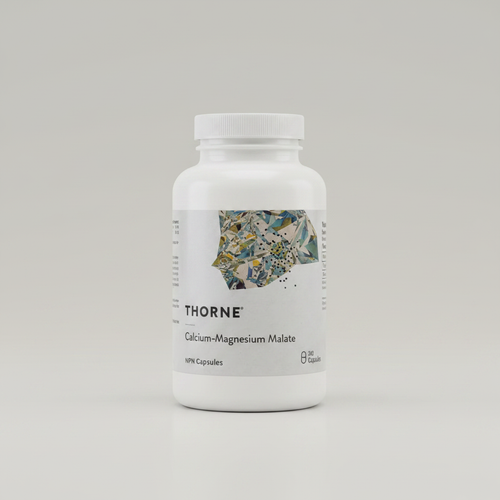 Thorne Calcium-Magnesium Malate bottle on neutral studio background