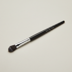 Mary Kay Eye Crease Brush on a neutral studio surface