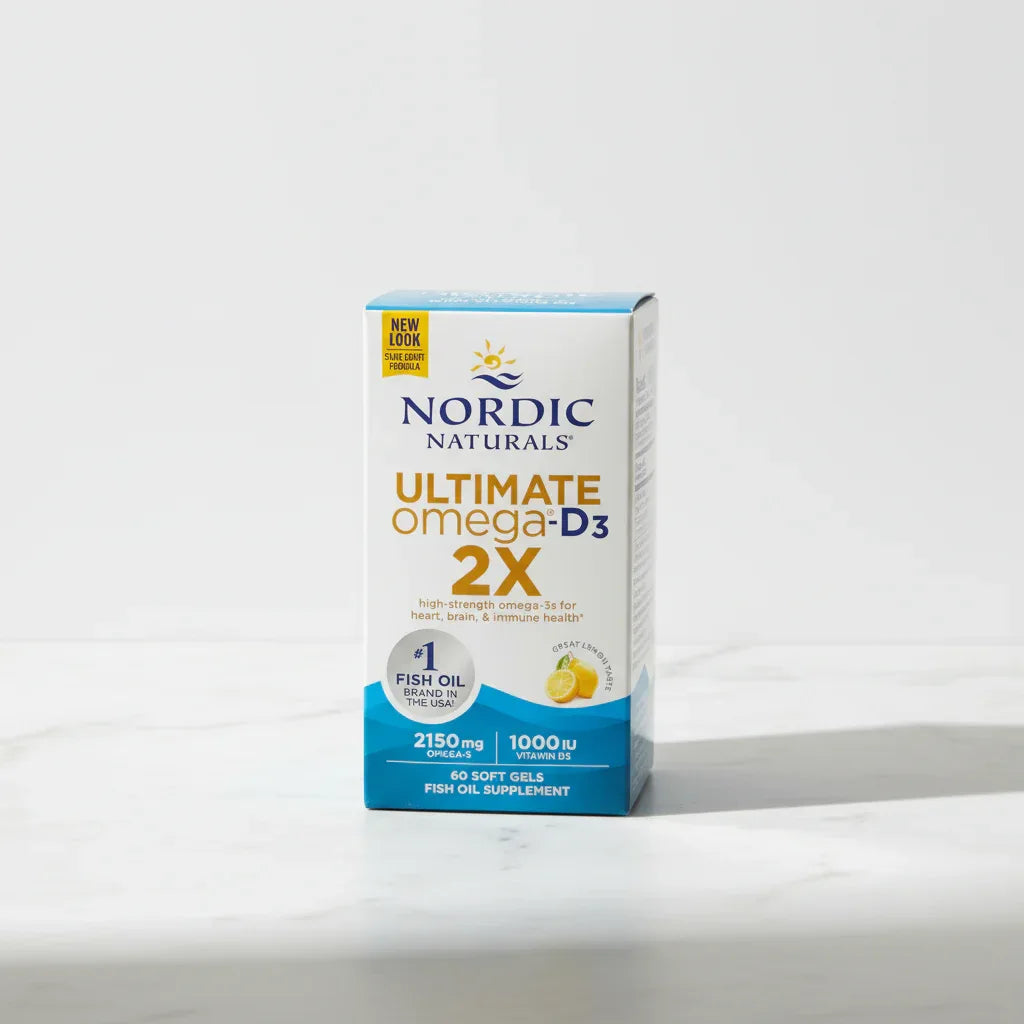 Clean minimalist studio photo capturing daily wellness supplement box on high-quality bright white marble surface