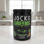 Jocko Fuel Jocko Greens Pineapple Coconut 300 g canister on a clean kitchen counter