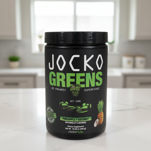 Jocko Fuel Jocko Greens Pineapple Coconut 300 g canister on a clean kitchen counter