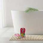 Gillette Venus Tropical Disposable Razors 6ct Bundle on bamboo bathroom mat next to white porcelain bathtub