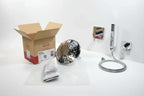 Studio interior staging of professional bathroom shower remodeling materials with polished chrome fixtures