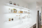 Nature's Bounty Probiotic CD box on kitchen wellness storage clear shelves white lighting